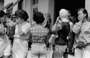 1965: Kindley AFB, Bermuda Seeing off friends at the MATS terminal, the place where many of us arrived and departed. In this picture, we're all being blasted by propwash from a Coast Guard plane on which our friend was leaving.